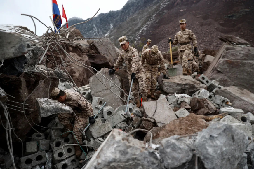 At least 8 dead after landslide buries dozens in southwest China in freezing winter temperatures